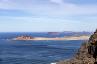 Wide view of several islands in the ocean, surrounded by blue sky, Canary Islands, Lanzarote,