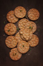 Crispbread, round, with salt and herbs, top view, food concept, no people