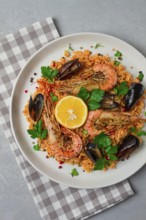 Seafood paella, shrimp and mussels risotto, rice, homemade, top view, no people