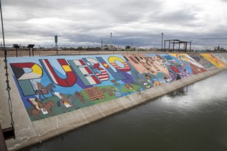 Pueblo, Colorado, Murals line a concrete levee for three miles along the Arkansas River. The levee