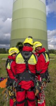 Height rescuers from the Gelsenkirchen fire brigade practise abseiling from a wind turbine from a