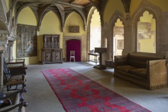 Furniture and wall tapestries in the Morning Room inside Berkeley castle, Gloucestershire, England,