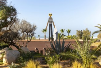 Surf school sign figure and surfboard, Radisson Blu Resort, Taghazout Bay Surf Village, Taghazout,