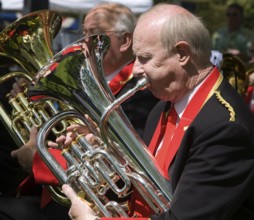 Musicians in a brass band perform during a country fair at Helmingham Hall, Suffolk, England,