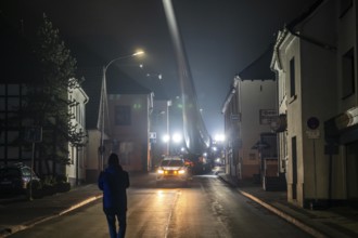 Transport of a 68 metre long, 22 tonne blade of a wind turbine, here in Breckerfeld, with a