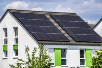 Solar roof, solar panels on a pitched roof of a residential building, renewable energy generation