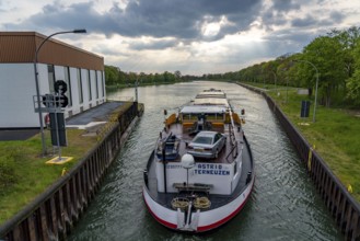 Cargo ship on the Wesel-Datteln Canal, leaving the Hünxe lock, North Rhine-Westphalia, Germany,