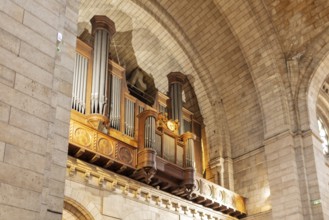 Large wooden church organ in an architecturally impressive interior, Paris