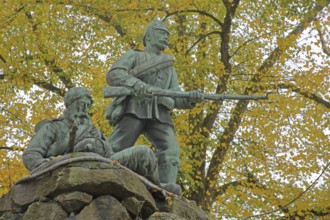 War memorial from 1904, soldiers with rifle sculpture, autumn atmosphere, market square,