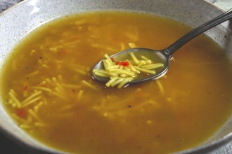 Chicken soup with noodles, homemade, no people, close-up