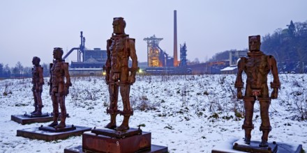 People made of iron, multi-part iron sculpture by Zbigniew Fraczkiewicz in front of the