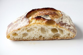 Cut open fluffy loaf of bread on white background. Generative AI, AI generated