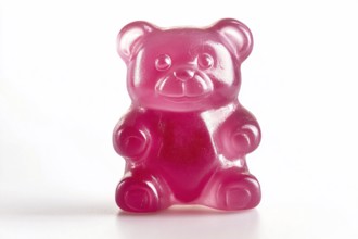 Cute opink jelly bear fruit gum candy on white background. Generative Ai, AI generated