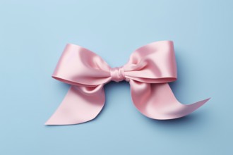 Pink silk ribbon on blue background. KI generiert, generiert AI generated