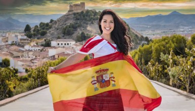 A woman with a white and red dress proudly presents the Spanish flag, mountains and buildings in