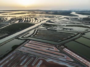 Saline ponds at the salt works near Chiclana de la Frontera. The orange-red colour depends on the