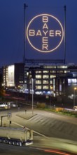 Bayer cross in the blue hour on the premises of Bayer AG, Leverkusen, Bergisches Land, North