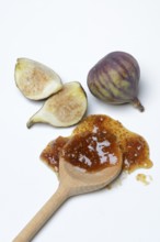 Fig jam in cooking spoon and fresh figs, Ficus carica