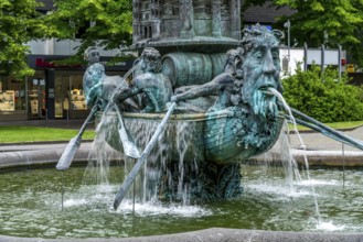 Detail of the historical column of the fountain on Josef-Görres-Platz in the historic centre of