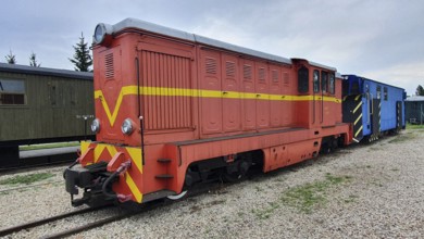 Red and yellow diesel locomotive on narrow-gauge tracks in the open air, Railway Museum, Elk, Elk,