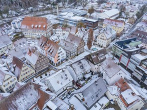 Snow-covered roofs and half-timbered houses in a historic town centre, Nagold, Black Forest,