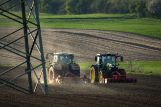 Tractor working a field near Grevenbroich, in spring, Germany, Europe