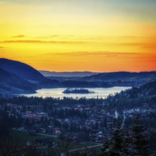 Idyllic landscape with lake and mountains at sunset, quiet village and bright sky, Schliersee