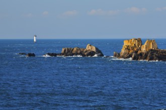 Evening view from the Pointe du Grouin with a view of the Phare de la Pierre-de-Herpin and striking