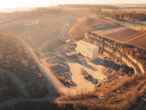 Panoramic view of a quarry with surrounding fields at sunrise, Magstadt, Germany, Europe