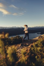 Trail running in autumn on the Jochberg on Lake Walchensee against the wonderful backdrop of the