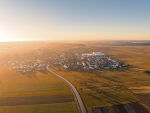 Wide aerial view of a village and fields at sunset, Obergaugstett, district of Calw, Black Forest,