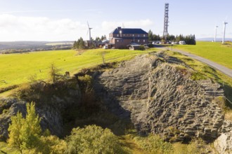 Basalt outcrop from a former quarry on the Hirstsein with mining hut, Erzgebirge, Marienberg