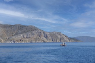 Fishing boat off the coast of Symi Island, Dodecanese, Greek Islands, Greece, Europe