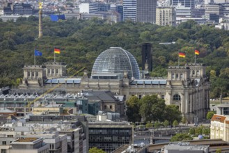 View of Reichstag with German flag. City view. Berlin, Germany, Europe