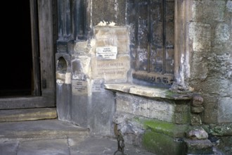 Flood levels recorded on the wall of St Margaret's Church, Kings Lynn, Norfolk, England, UK 1987