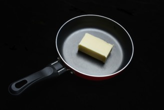 A knob of butter in a pan