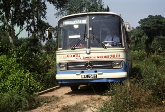 Mercedes Benz coach on a dirt road to Vaama, Sierra Leone, West Africa 1978, Africa