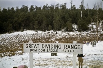 Sign for Dom Dom Saddle of the Great Dividing Range, Victoria, Australia 1956 Children playing in