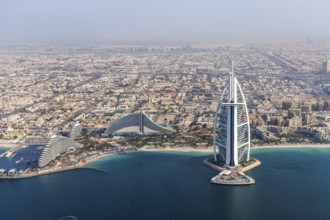 Dubai Burj Al Arab luxury hotel aerial view aerial view by the sea from above in Dubai, United Arab