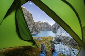 Wild camping, camping in the wilderness with a tent, Kol Suu mountain lake, Sary Beles Mountains,