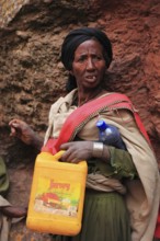 Pilgrim at the rock-hewn churches in Lalibela, container for holy water, Ethiopia, Africa