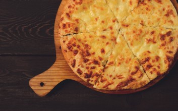 Imereti khachapuri, Traditional Georgian dish, flatbread with cheese, top view, no people, rustic