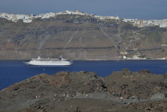 Cruise tourists on the volcanic island Nea Kameni in the caldera, Santorin, Cyclades, Greece,