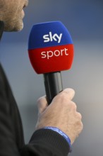 Hand holding microphone, SKY logo, PreZero Arena, Sinsheim, Baden-Württemberg, Germany, Europe