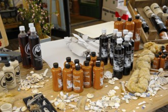 Market stall with typical liqueurs, shopping street, Den Burg, Texel Island, North Sea, North