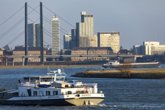 Düsseldorf, city centre skyline, skyscrapers, Rheinkniebrücke, Rhine, cargo ship