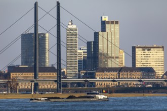 Düsseldorf, city centre skyline, skyscrapers, Rheinkniebrücke, Rhine, cargo ship