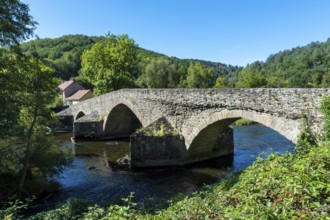 The old medieval bridge at Menat over the river Sioule. Puy de Dome department.