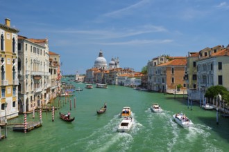 VENICE, ITALY, JULY 19, 2019: View of Venice Grand Canal with boats and Santa Maria della Salute