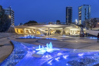 Modern architecture and colourfully lit fountains of Eleftheria Square at dusk, Nicosia, Cyprus,